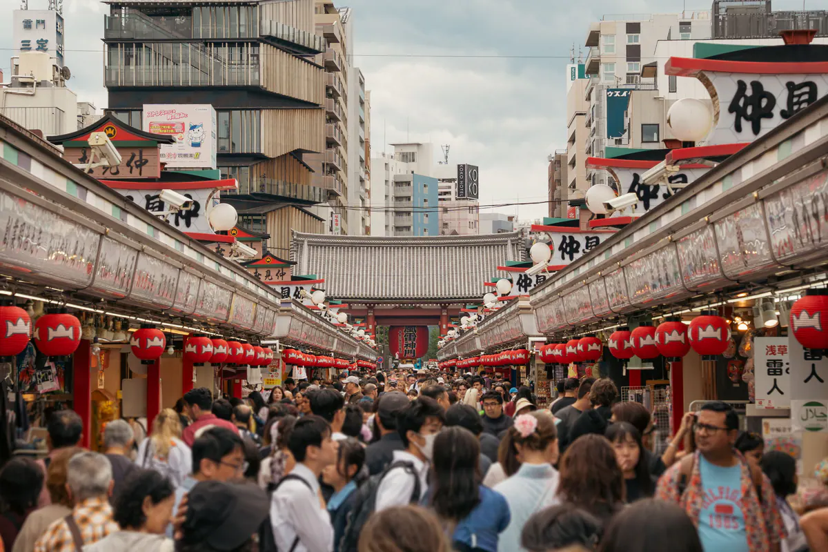 Crowds browsing the lantern-lined Nakamise shopping approach in Asakusa